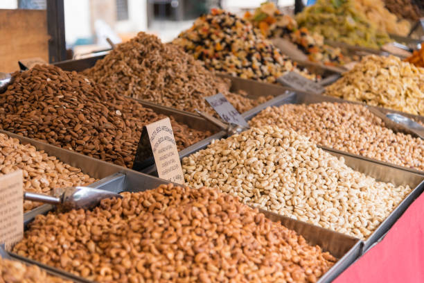 Brazil nuts and other nuts on a market in bowls