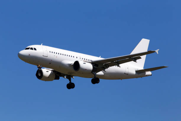 White aircraft on the blue sky background stock photo