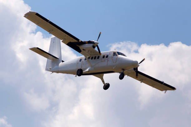 istock White aircraft on the cloudy sky background 978329004