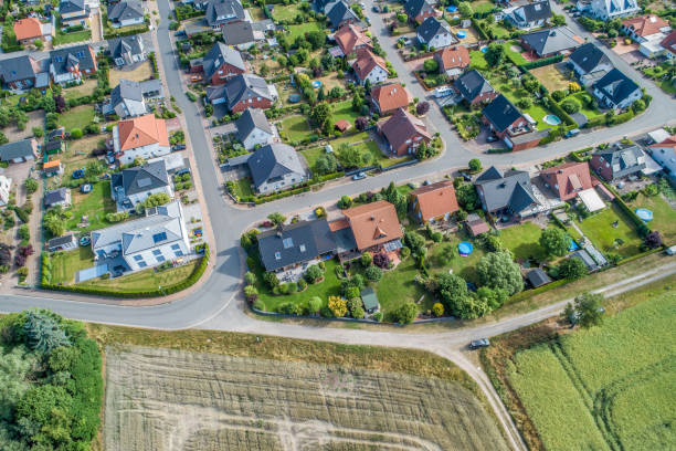 istock Typical German new housing development in the flat countryside of northern Germany between fields and meadows 978329744