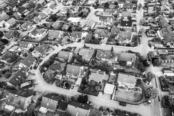 istock Typical German new housing development in the flat countryside of northern Germany between fields and meadows, black and white 978331906