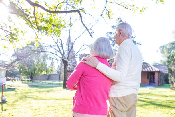 istock Elderly coiple enjoying sun in the garden 978333438