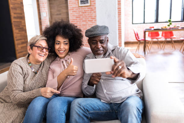 istock Family taking selfie at home 978335780