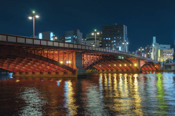 istock Illuminated Bridge Over River In City At Night 978349862