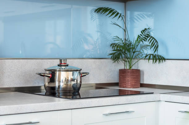istock Stainless steel pot on induction electric hob. 978350592