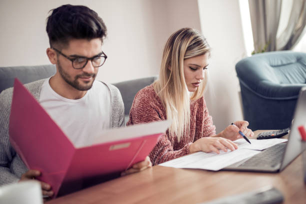 istock Young couple paying their bills online 978350668
