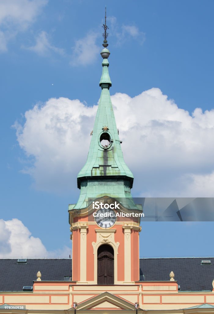Tower and spire on the Town Hall in Melnik Town in The Czech Republic Tower on the Town Hall in Melnik a Town in The Czech Republic, Europe, with a blue summer sky and clouds as backdrop Architecture Stock Photo