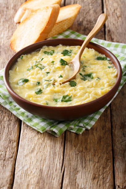 istock Italian egg soup stracciatella with farfalline pasta close-up. vertical 978356434