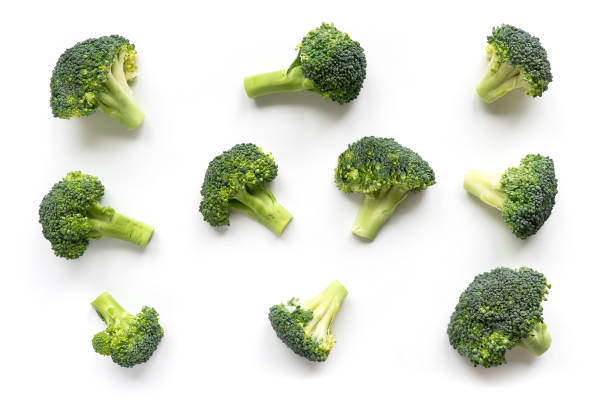Green broccoli pattern food. Isolated vegetable on white background. Top view. broccoli photos stock pictures, royalty-free photos & images