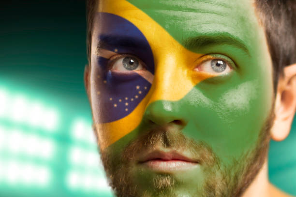 istock Man painted with Brazilian flag 978374570