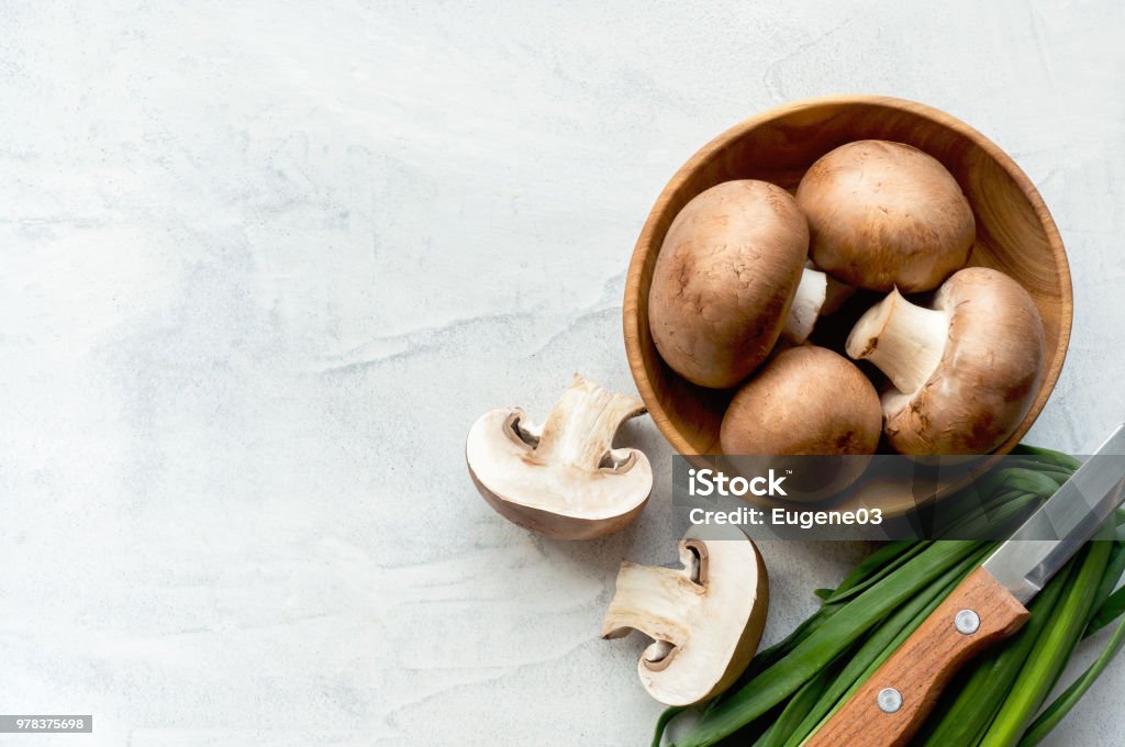 Sliced brown champignons on concrete background. Top view. - Royalty-free Cogumelo Foto de stock