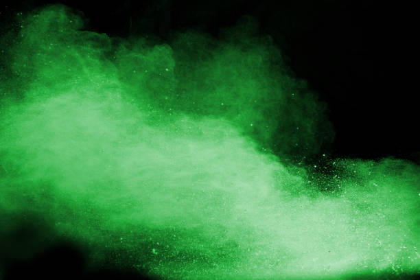 istock abstract green dust explosion on  black background.abstract green powder splattered on black background.Freeze motion of green powder exploding. 978382366