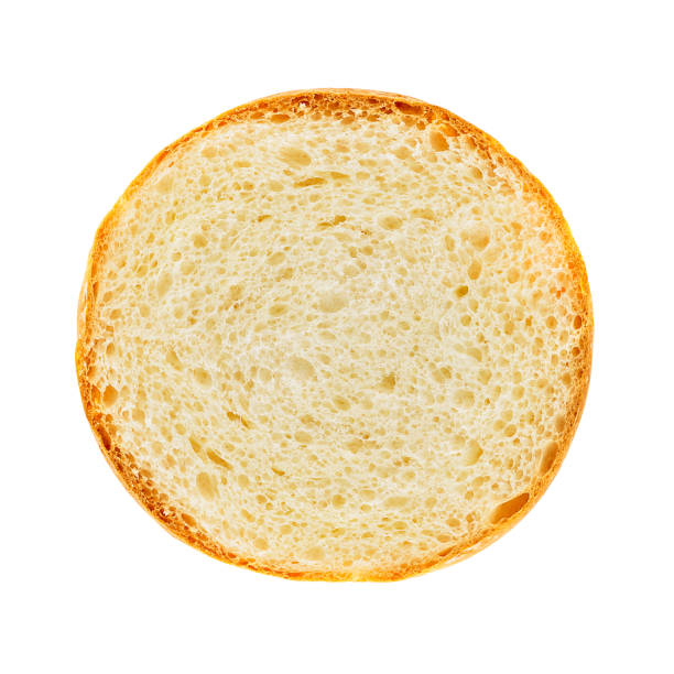 Burger bread section Surface of burger bread section isolated on white background with clipping path slice of bread stock pictures, royalty-free photos & images