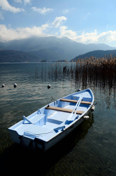 istock Blue small boat on Annecy lake 978389758