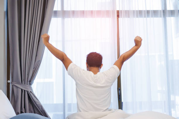istock Man stretching in bed after wake up in the morning. 978390186