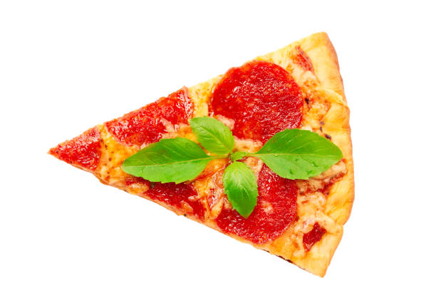 Piece of pepperoni pizza with basil leaves izolated on white background. Top view
