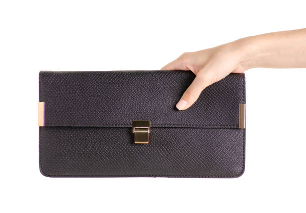 istock Black leather female bag clutch in hand 978411174
