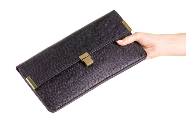 istock Black leather female bag clutch in hand 978411216