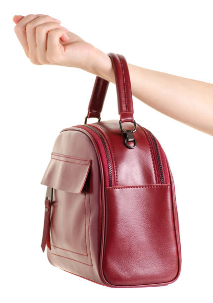 istock Red leather female bag in hand 978411330