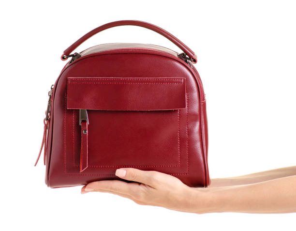 istock Red leather female bag in hand 978411384