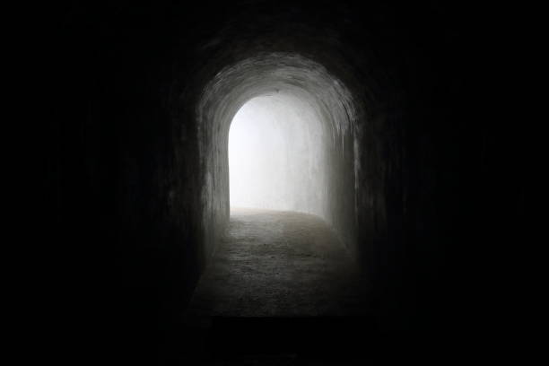 istock dark tunnel with light at the end 978417790