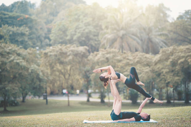 istock asian chinese couple performing yoga pose 978418078