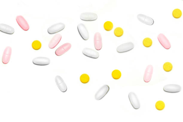 istock a lot of multicolored pills and tablets on the white background with copy space for text. Close up 978423780
