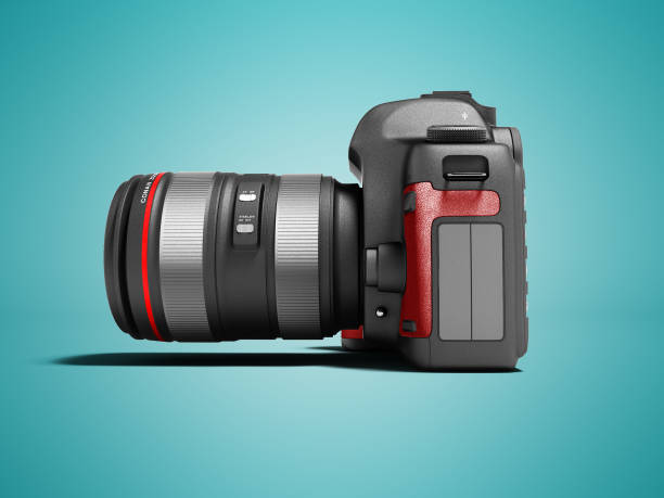 istock Modern gray zoom camera with red leather inserts on the side 3d render on blue background with shadow 978424284