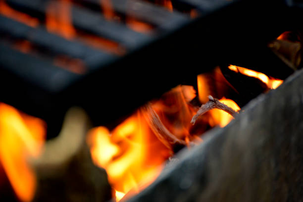 istock Firewood in the flames under the barbecue grill 978427162