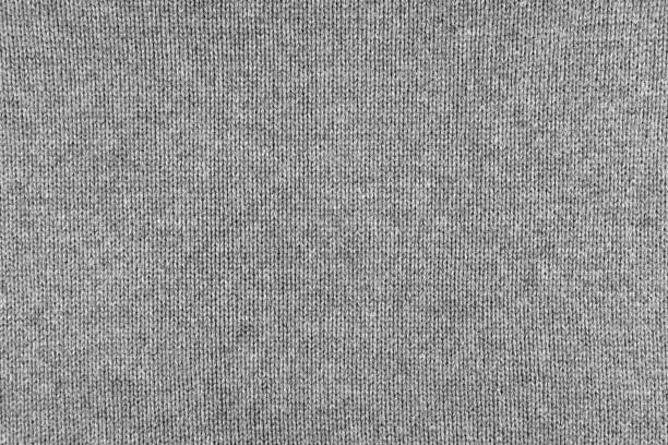 istock Cloth knitted wool background. Fabric knitting wool texture neutral gray color. 978432314