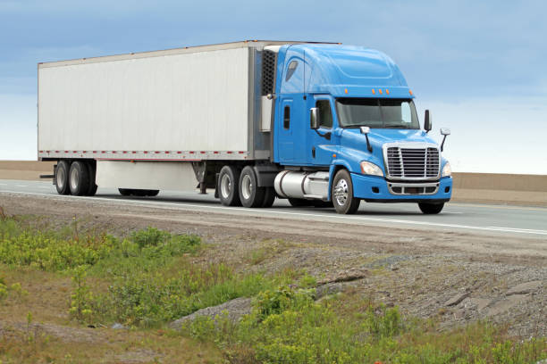 istock Semi Truck Travelling On Highway 978433442