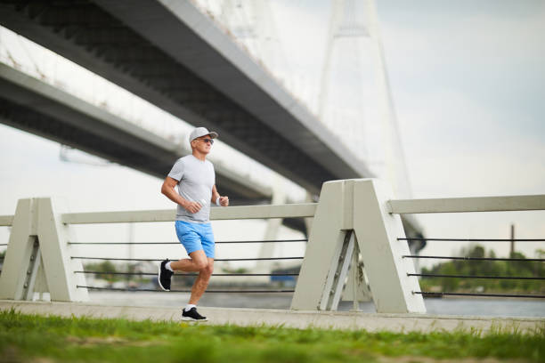 istock Sportsman jogging 978437278