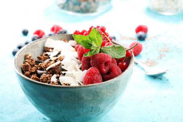 istock granola healthy breakfast with natural yogurt, muesli and berries 978437610