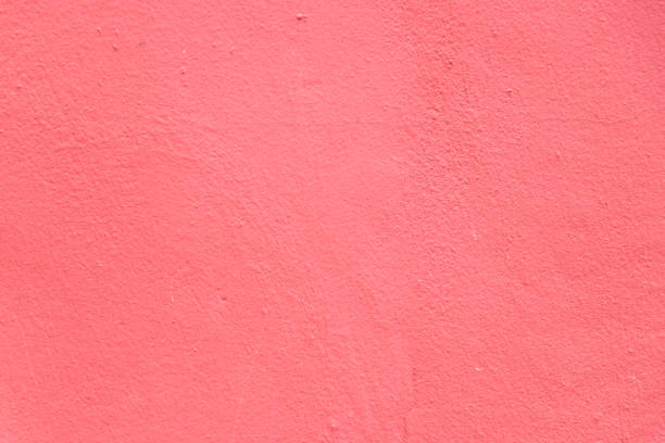 istock Grunge red color concrete wall textured background 978444970