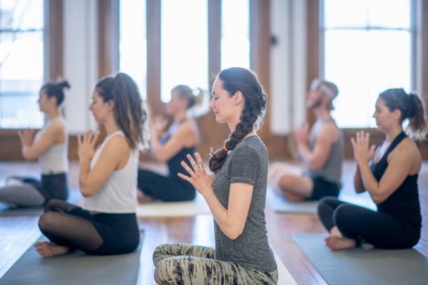 istock Women meditating indoors 978449998