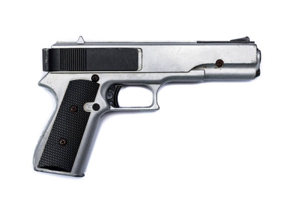 istock Black & Silver Hand Gun isolated on a white background 978450120