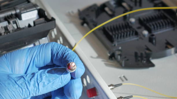 istock Installation of a yellow fiber optic cable 978453444