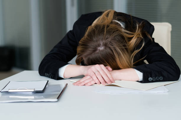 istock stress deadline overworking exhausted woman desk 978476466