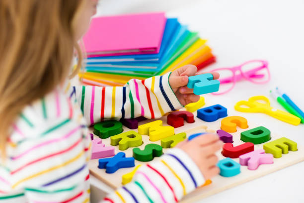 istock Child doing homework for school. Kids learn and paint. 978476944