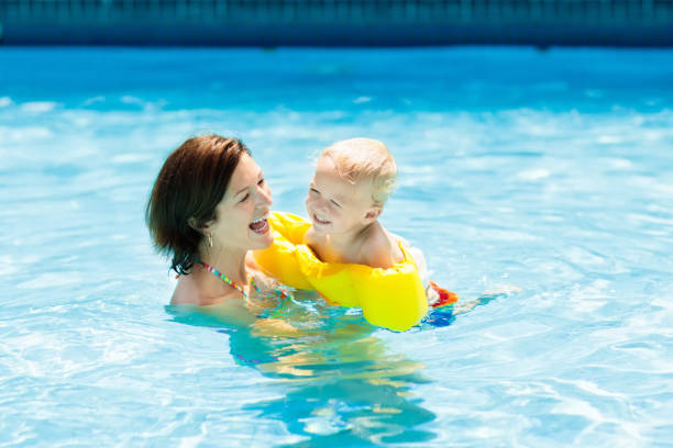istock Mother and baby in swimming pool 978483846