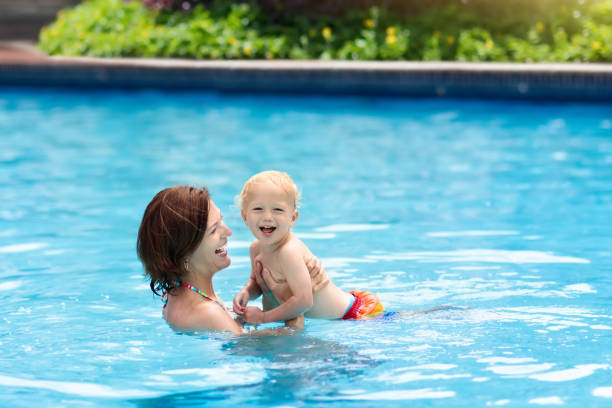 istock Mother and baby in swimming pool 978484054