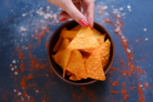 istock tortilla nacho chips recipe hand holding crisp 978484326