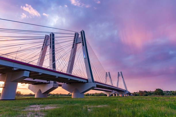 Cable stayed bridge over Vistula river, Krakow, Poland, beautiful colorful sunset
