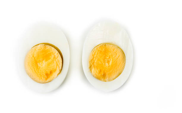 istock Hard boiled egg cut in halves on the white 978491364
