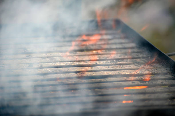 istock Flames from the fire under the barbecue grill 978491542