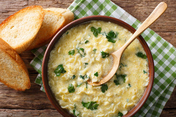 istock Italian food: soup stracciatella with farfalline and cheese close-up. horizontal top view 978491680