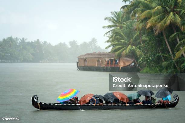 Monsoon Time People Crossing A River By Boat In Rain Stock Photo - Download Image Now