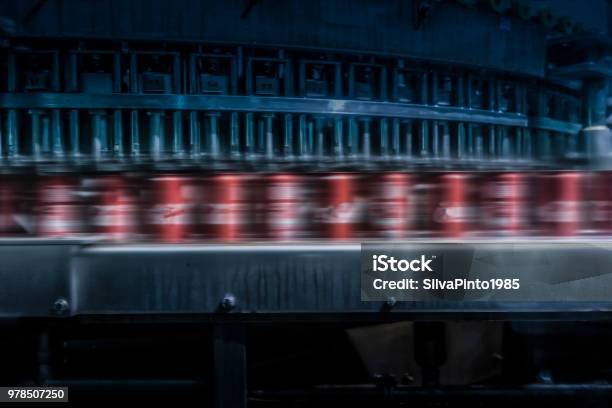 Soda Cans To Pass With Speed On The Factory Line Stock Photo - Download Image Now - Carbonated, Innovation, Soda
