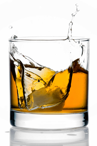 Ice Splash in a Glass of Whisky