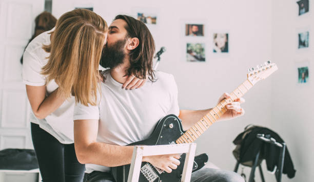 istock Couple playing guitar together 978513422